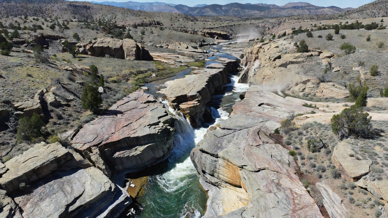 Close up of water emerging from a fault fracture in high elevation rock formations